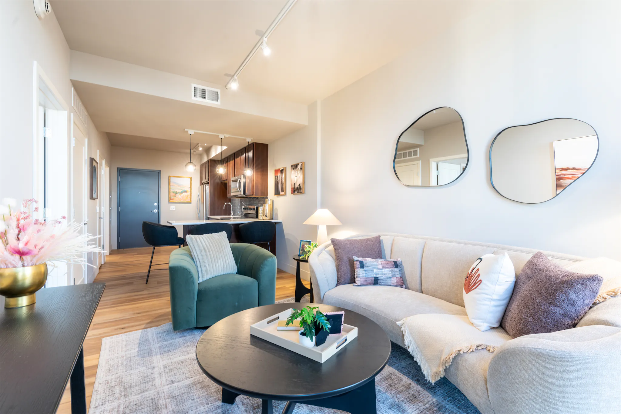 Open-plan lounge area in a one-bedroom apartment at The Duo