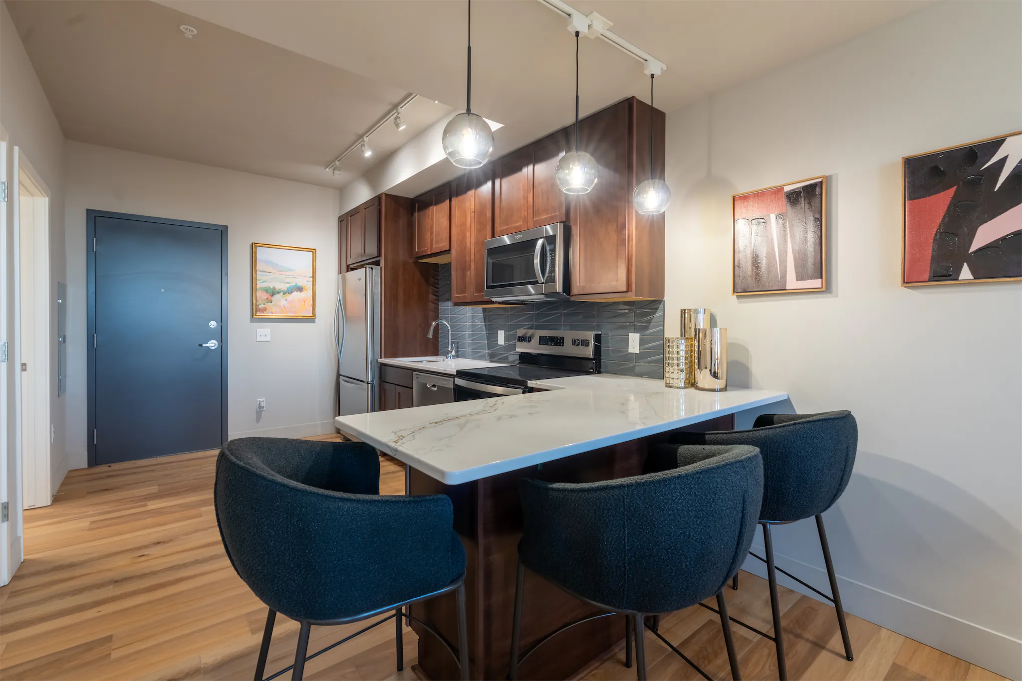 Apartment bedroom with large windows and city-style decor