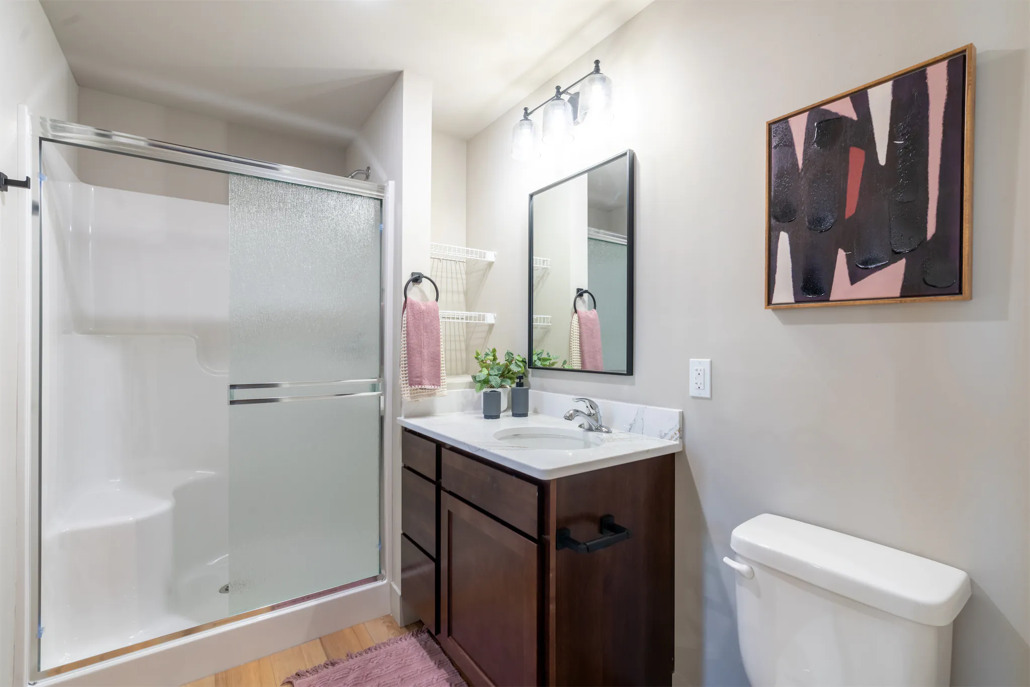 Warm-toned bedroom design in a Duo apartment home